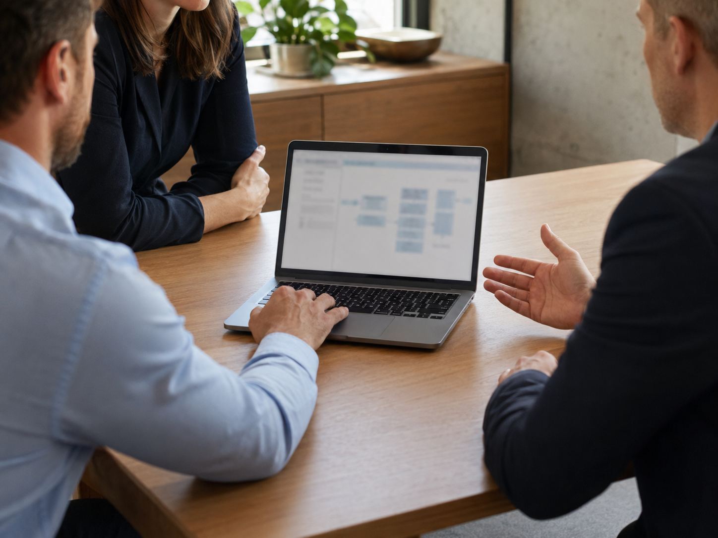 An advisor and a senior leader reviewing a marked-up project plan together